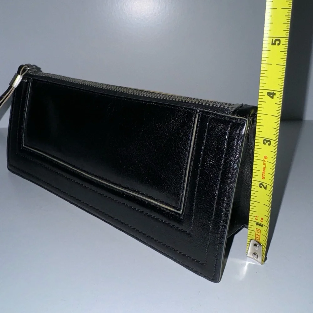 Ellen Tracy Black Leather Clutch with red logo interior.